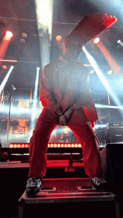 Man In Red Jacket With Bag On Head GIF