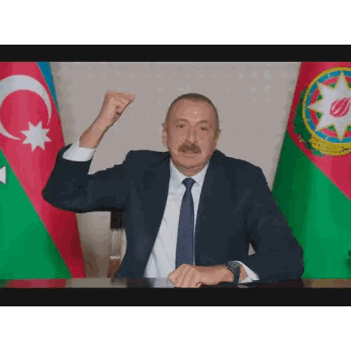 Man In Red Jacket With Bayraktar Name Sticker