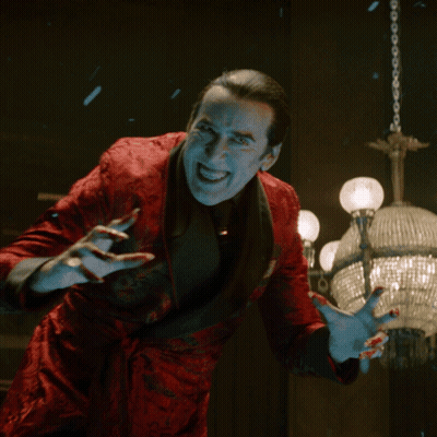 Man In Red Jacket With Blood On Hands GIF
