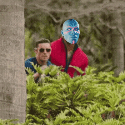 Man In Red Jacket With Blue Painted Face GIF