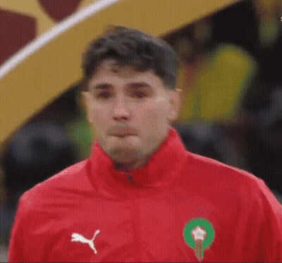 Man In Red Jacket With Green Circle GIF