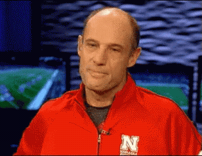 Man In Red Jacket With Letter N GIF