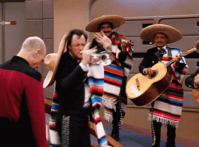 Man In Red Jacket With Mariachi Musicians GIF