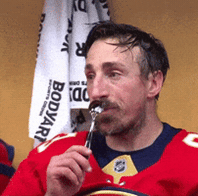 Man In Red Jersey Eating Food GIF