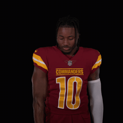 Man In Red Jersey Number 10 Holding Football GIF
