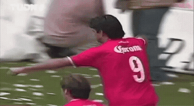 Man In Red Jersey Playing Soccer GIF