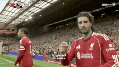 Man In Red Jersey Saying Standard Chartered GIF