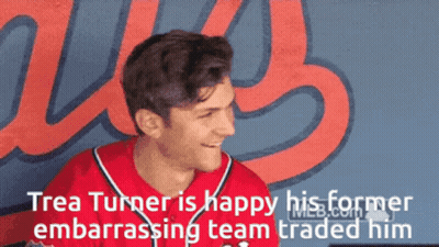 Man In Red Jersey Smiling By Us Wall GIF
