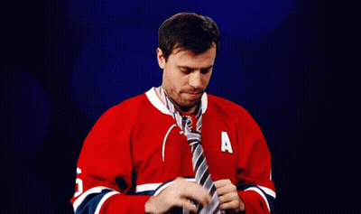 Man In Red Jersey Tying Tie GIF