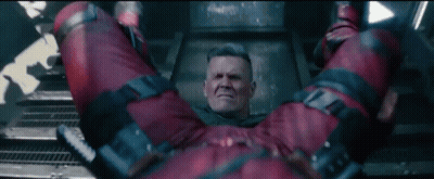 Man In Red Jumpsuit Lying On Back GIF