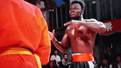 Man In Red Karate Fighting Yellow Belt GIF