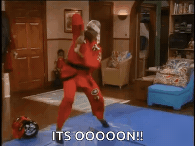 Man In Red Karate Outfit On Blue Mat GIF