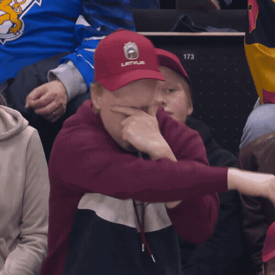 Man In Red Latvija Hat Covering Face GIF