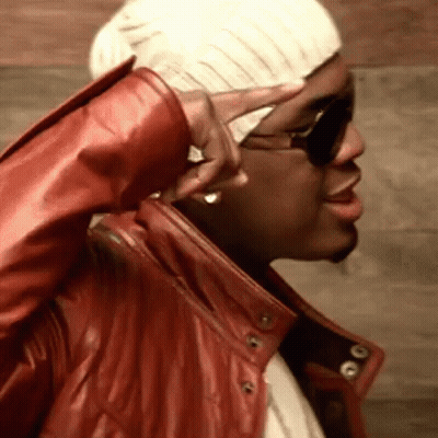 Man In Red Leather Jacket And White Hat Making Peace Sign GIF
