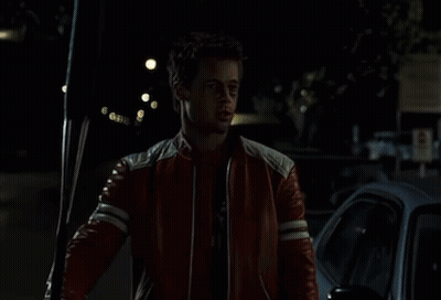 Man In Red Leather Jacket Holding Soda GIF