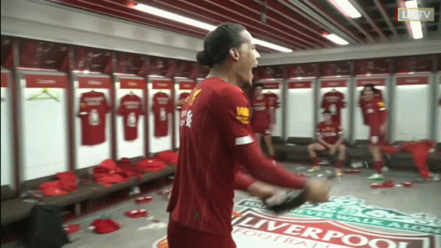 Man In Red Liverpool Jersey In Locker Room GIF