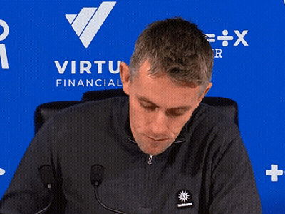 Man In Red Manchester United Jersey Next To Table GIF