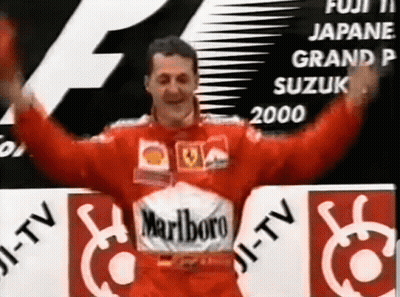 Man in Red Marlboro Shirt in Front of Fuji Sign