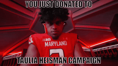 Man In Red Maryland Jersey Standing In Dark Room GIF