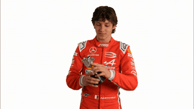 Man In Red Mercedes Racing Suit Holding Key GIF