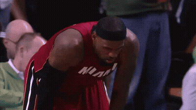 Man In Red Miami Jersey Looking Down GIF