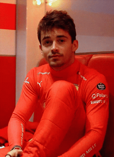 Man In Red Mille Shirt Sitting GIF