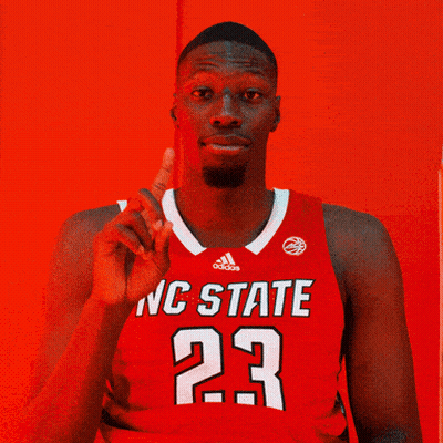 Man In Red NC State Jersey Pointing Up GIF