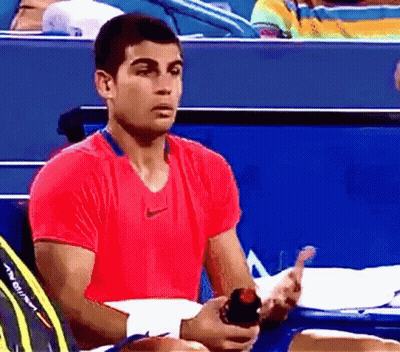 Man In Red Nike Shirt Holding Water Bottle GIF