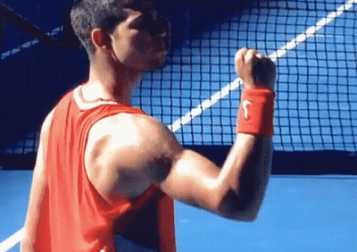 Man In Red Nike Tank Top Flexing GIF