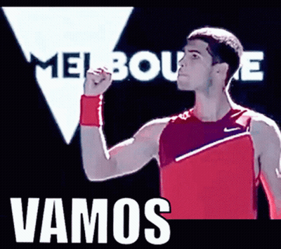 Man In Red Nike Tank Top In Front Of Melbourne Sign GIF