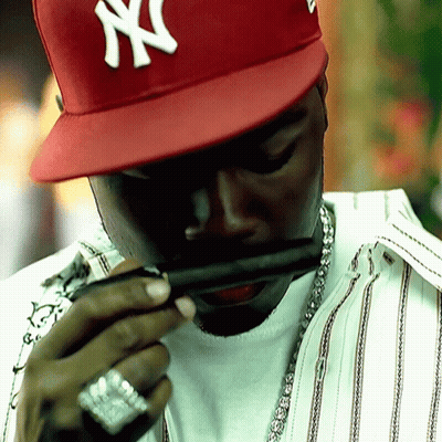 Man In Red NY Hat Smoking GIF
