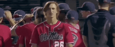 Man In Red Ole Miss Baseball Jersey Standing In Front Of Crowd GIF
