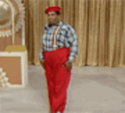 Man In Red Pants And Suspenders Standing GIF