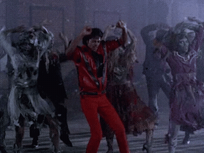 Man In Red Pants Dancing With Zombies GIF