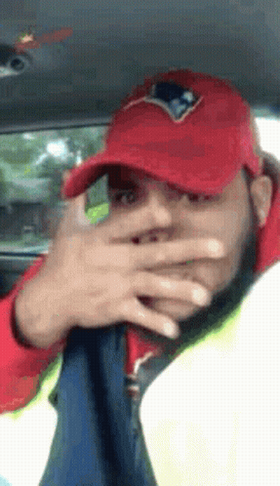 Man In Red Patriots Hat Covering Face GIF