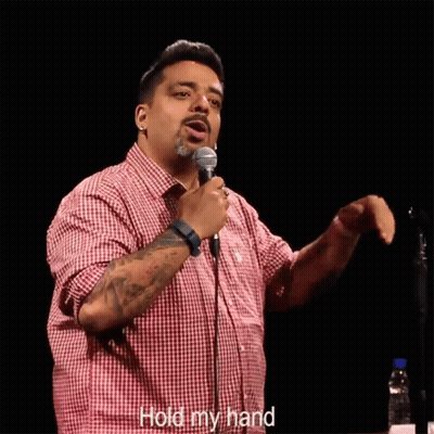 Man In Red Plaid Shirt Holding Microphone Saying Hold My Hand GIF