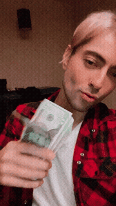 Man In Red Plaid Shirt Holding Stack Of Money GIF