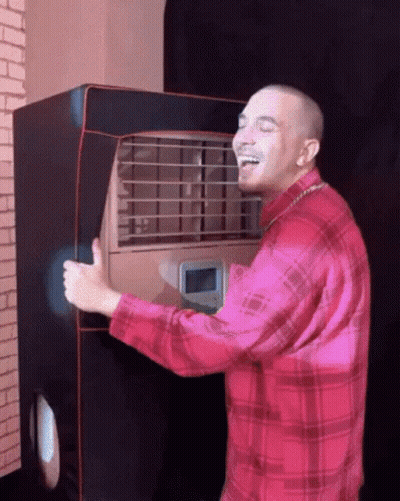 Man In Red Plaid Shirt Laughing Holding Machine GIF