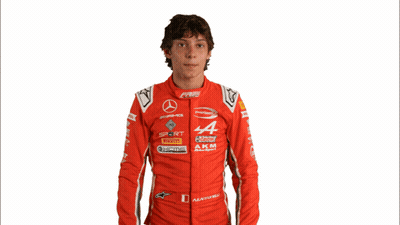 Man In Red Racing Suit With AKM GIF