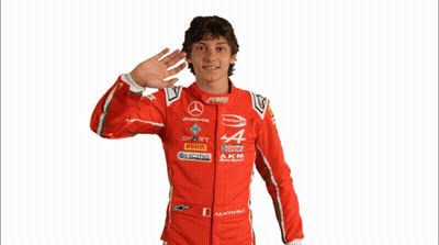 Man In Red Racing Suit With Letters A And M GIF