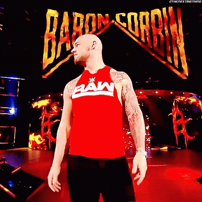 Man In Red Raw Tank Top Baron Corbin Sign GIF