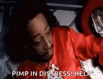 Man In Red Robe Laying In Bed Saying Pimp In Distress GIF