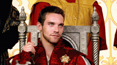 Man In Red Robe Sitting In Throne GIF