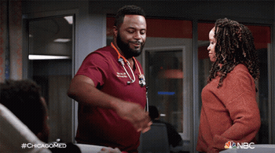 Man In Red Scrub Talking To Woman In Red Sweater #Chicagomed GIF