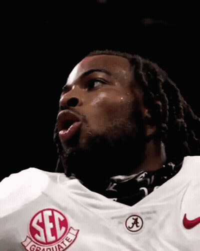 Man In Red SEC Jersey With Falling Confetti GIF