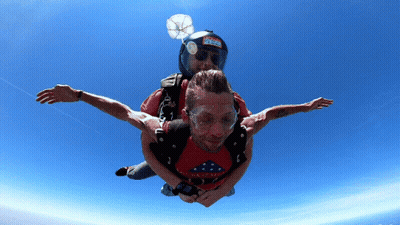 Man In Red Shirt 'America' Lifted By Another Man GIF