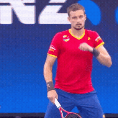 Man In Red Shirt And Blue Shorts Holding Tennis Racket GIF