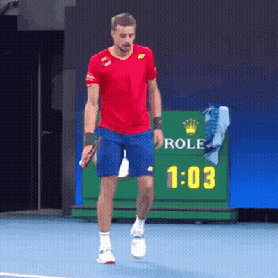Man In Red Shirt And Blue Shorts With Rolex Sign GIF
