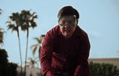 Man In Red Shirt And Goggles Looks Angry GIF