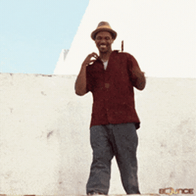 Man In Red Shirt And Hat Waving GIF
